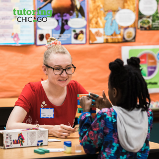 A tutor explains a concept to a student using blocks